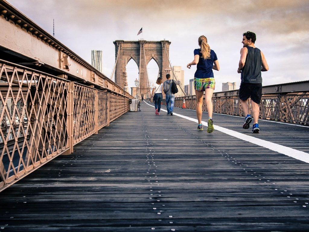 people walking on a bridge